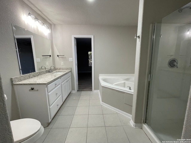 full bathroom with tile patterned floors, a textured ceiling, toilet, vanity, and shower with separate bathtub