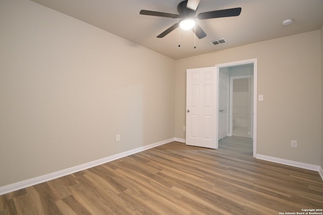 empty room with wood-type flooring and ceiling fan