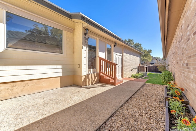 view of side of home with a patio