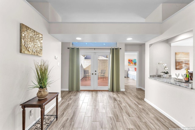 interior space with light wood-type flooring and french doors