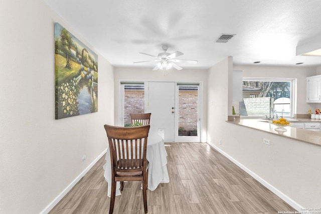 dining space with ceiling fan