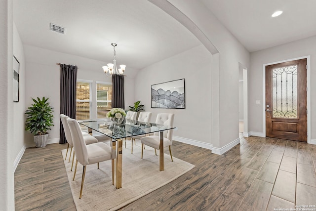 dining area with an inviting chandelier