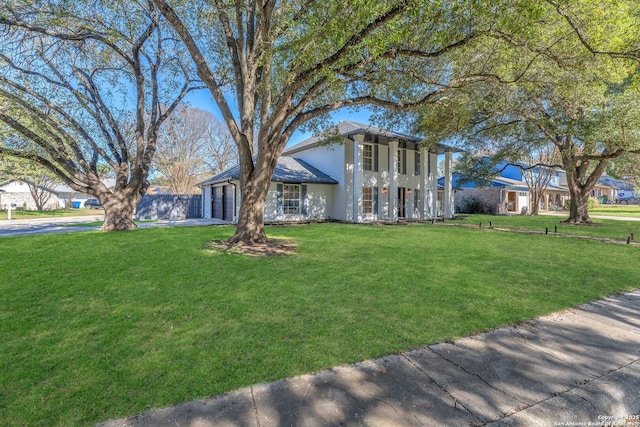 view of front of home with a garage and a front yard