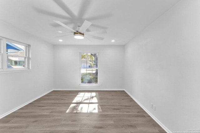 empty room featuring ceiling fan and dark hardwood / wood-style flooring