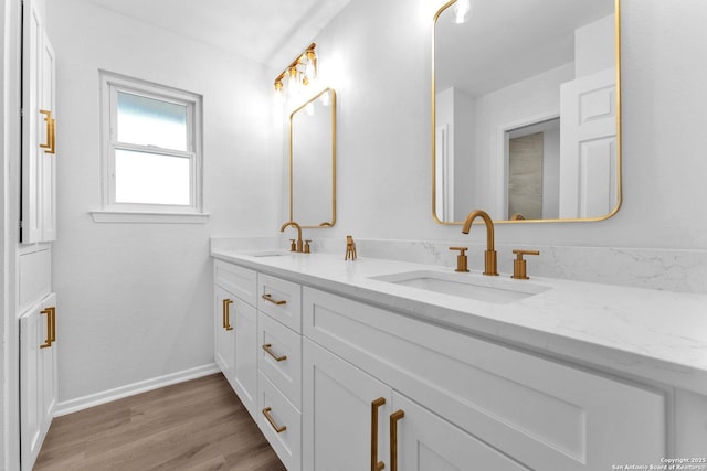 bathroom featuring vanity and wood-type flooring