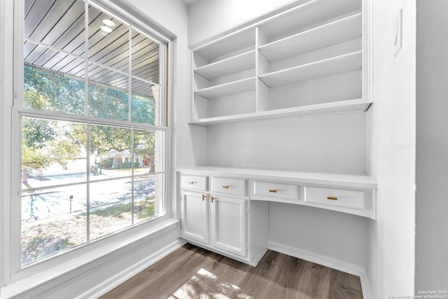 unfurnished office featuring hardwood / wood-style floors