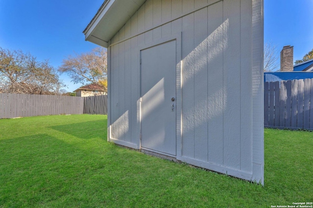 view of outdoor structure with a lawn