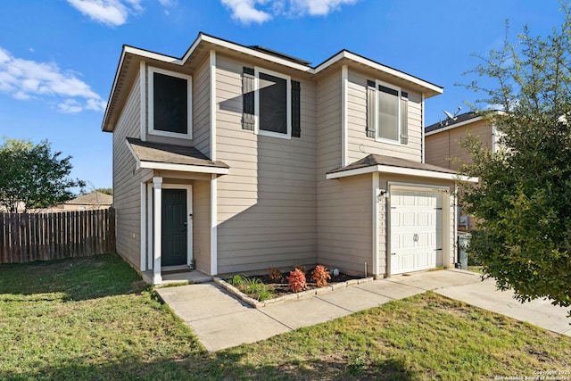 view of front of home with a front lawn and a garage