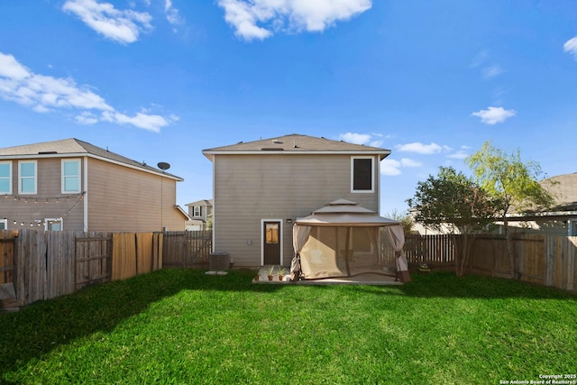 rear view of property with cooling unit, a lawn, and a patio