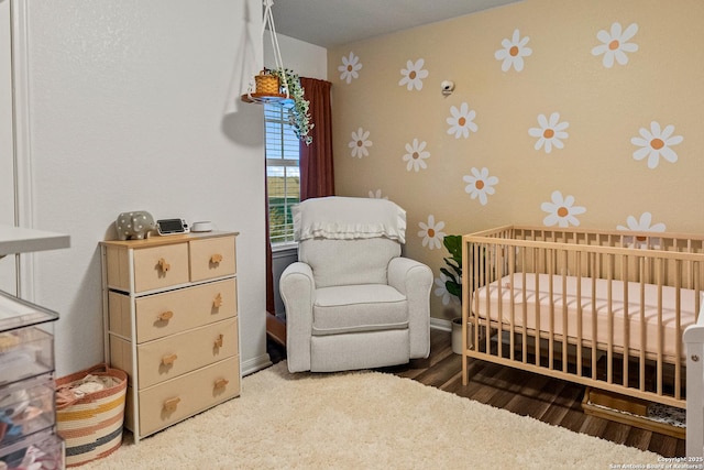 bedroom featuring a nursery area