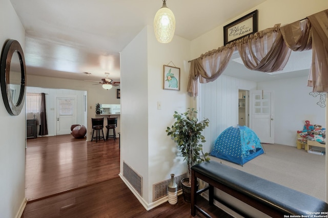 hall featuring dark wood-type flooring