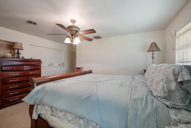 bedroom with light carpet and ceiling fan