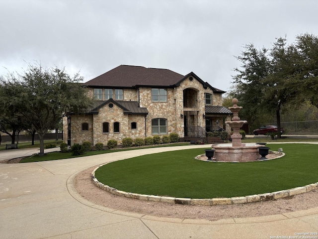 12007 Bobbi Way, San Antonio, TX 78245 - french provincial home with stone siding, a standing seam roof, a front yard, and curved driveway