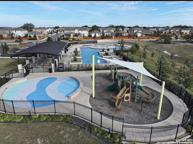 view of pool featuring a playground