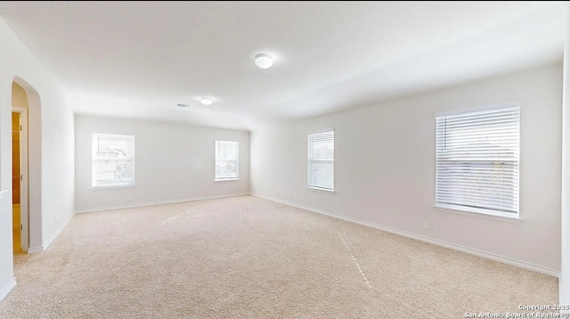 unfurnished room with light colored carpet