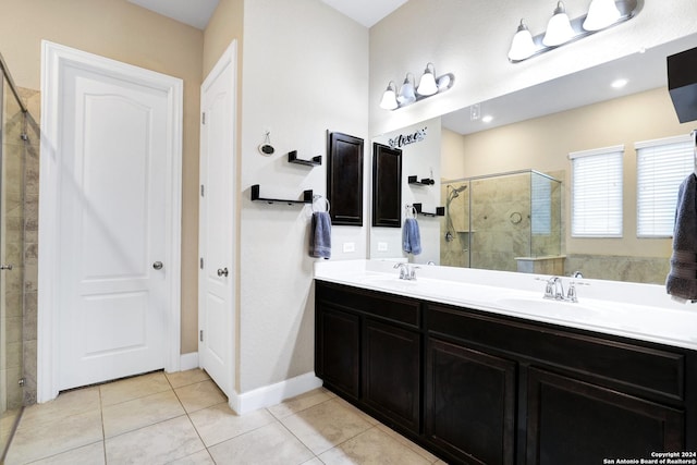 bathroom featuring vanity, tile patterned floors, and an enclosed shower