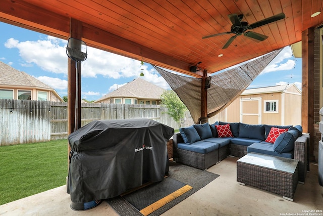 view of patio / terrace featuring outdoor lounge area, ceiling fan, a shed, and grilling area