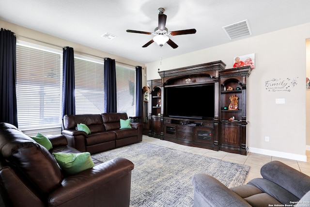 living room featuring ceiling fan and light tile patterned flooring