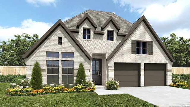 view of front of home with a front yard and a garage