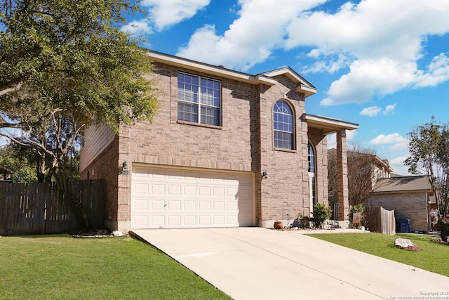 view of front of house with a front yard and a garage