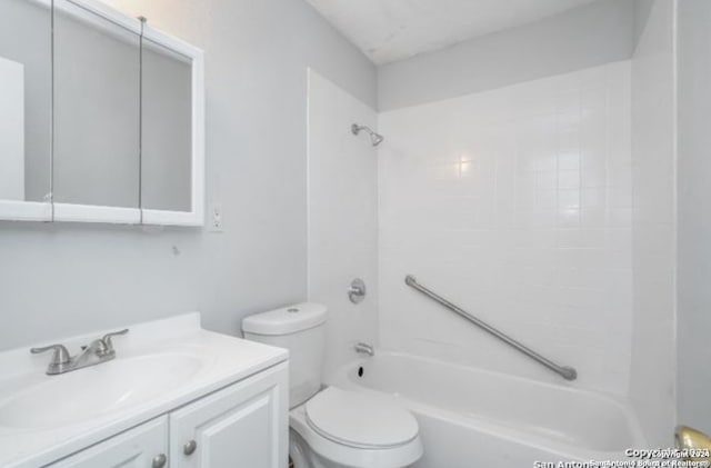 full bathroom with vanity, tiled shower / bath combo, and toilet