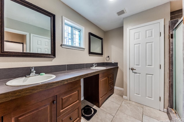 bathroom featuring tile patterned flooring, vanity, and an enclosed shower