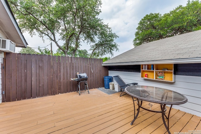 wooden terrace featuring grilling area