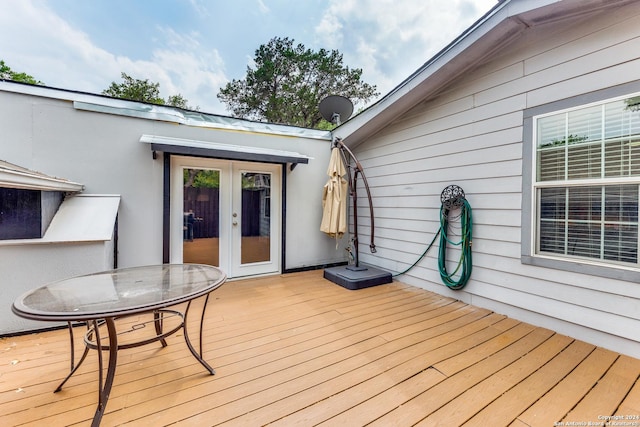 wooden terrace featuring french doors