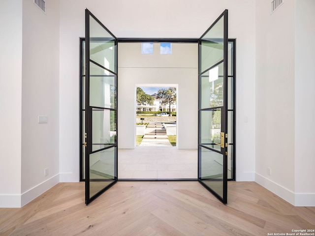 entryway featuring light parquet floors