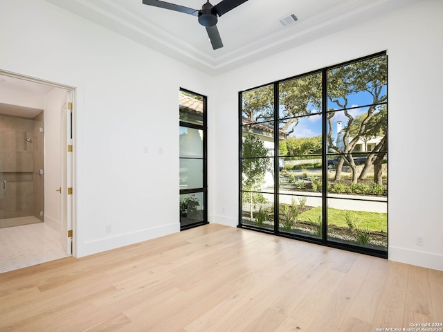 spare room with light hardwood / wood-style flooring and ceiling fan