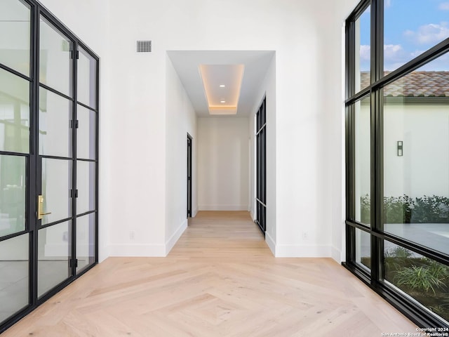 hallway with light parquet flooring