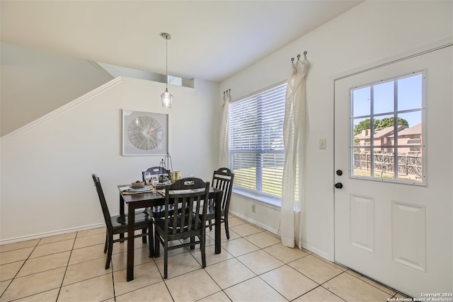 dining space with a healthy amount of sunlight and light tile patterned floors