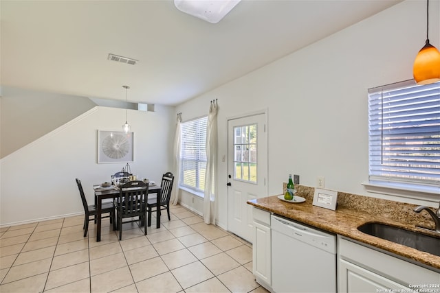 dining space with light tile patterned flooring and sink