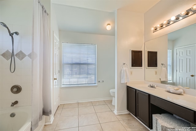 full bathroom with tile patterned floors, vanity, toilet, and shower / tub combo with curtain