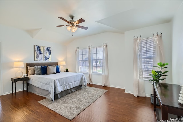 bedroom with dark hardwood / wood-style flooring, ceiling fan, and lofted ceiling