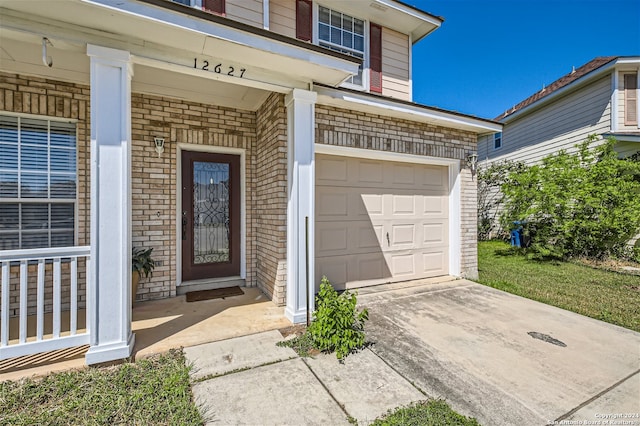 doorway to property featuring a garage