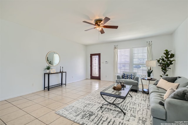 living room with ceiling fan and light tile patterned flooring