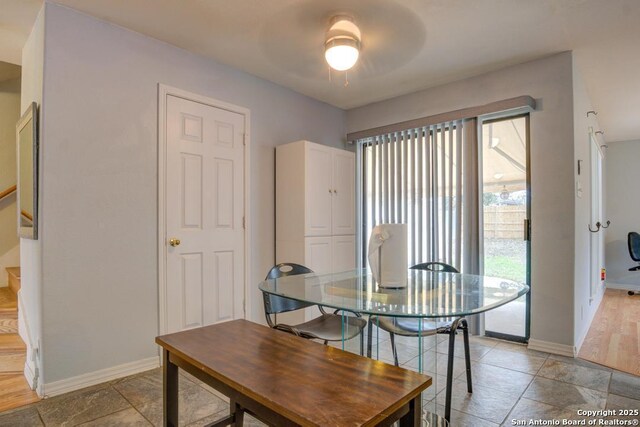 dining room featuring ceiling fan