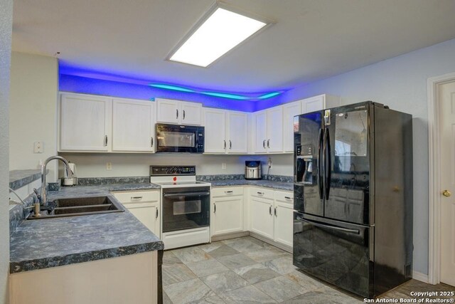 kitchen featuring white cabinetry, sink, and black appliances