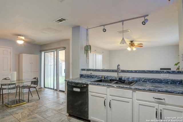 kitchen with white cabinets, sink, black dishwasher, and a wealth of natural light