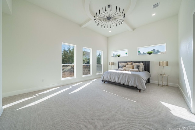 bedroom with carpet flooring, a towering ceiling, and beamed ceiling