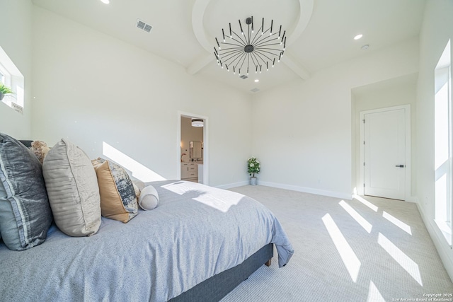 carpeted bedroom featuring ensuite bathroom, beam ceiling, and a high ceiling