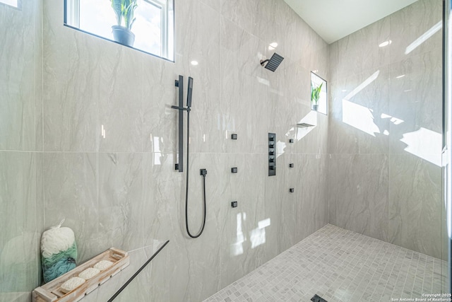 bathroom featuring tiled shower