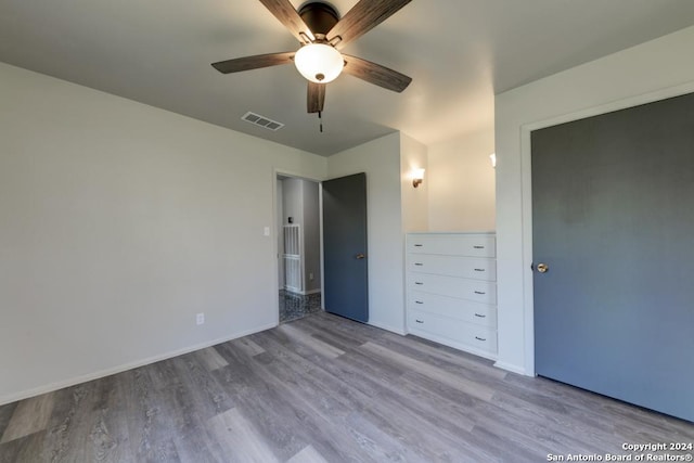 unfurnished bedroom featuring ceiling fan and light hardwood / wood-style floors