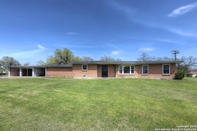 ranch-style home featuring a front yard