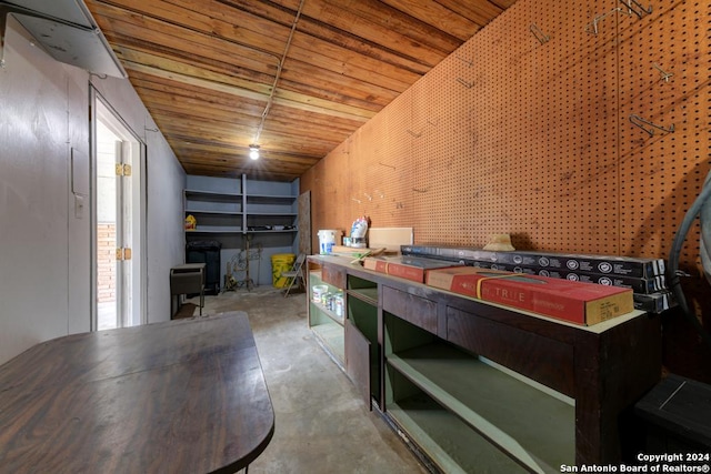 interior space featuring wood ceiling and concrete floors