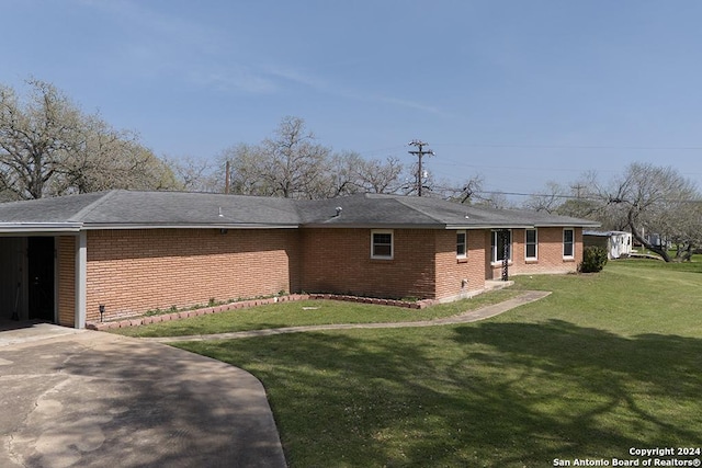 back of house with a yard and a carport