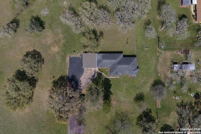 birds eye view of property with a rural view