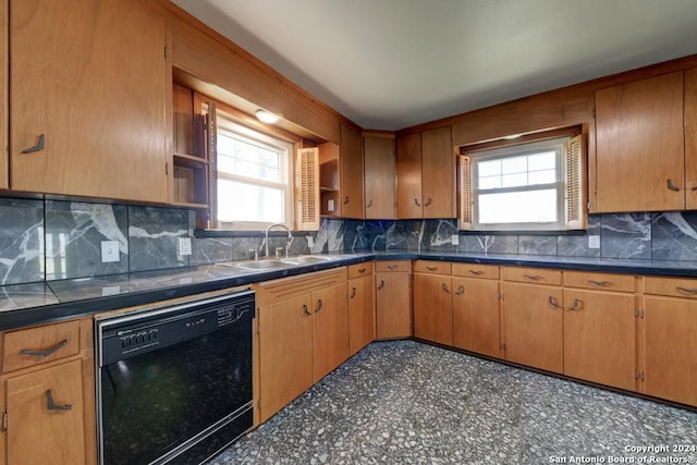 kitchen with sink, black dishwasher, and tasteful backsplash