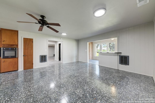 unfurnished living room featuring ceiling fan